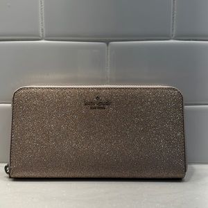 Kate Spade zip around continental wallet in rose gold glitter! 4” x 8”